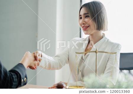Lawyer handshake with a client making about documents, contracts, agreements, cooperation agreement 120013360
