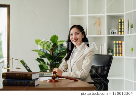 Woman lawyer confident working about ducument at desk and looking at camera Woman lawyer confident working about ducument at desk and looking at camera 120013364