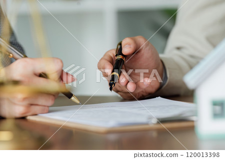 Hand of lawyer pointing at document agreement, contract for businessperson, client signing contract about real estate 120013398