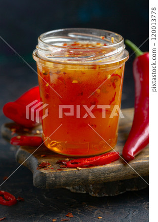 Jar of spicy honey in close-up. Jar of spicy honey in close-up. 120013778