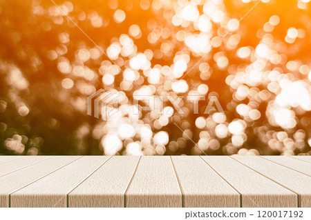 Wooden Table with Light Beam, Shadow, and Bokeh Background 120017192