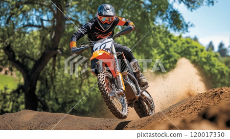 Young Male Motocross Rider in MidJump Action on Dusty Track with Vibrant Gear 120017350