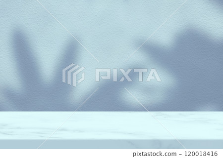 White Marble Table with Palm Leaves Shadow on Cyan Blue Wall Texture Background White Marble Table with Palm Leaves Shadow on Cyan Blue Wall Texture Background 120018416