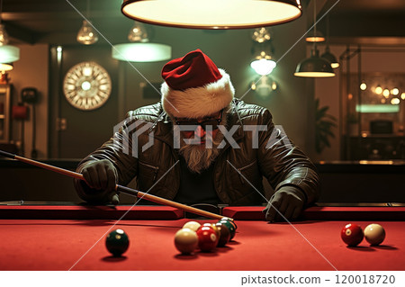 A man in a santa hat is playing pool 120018720