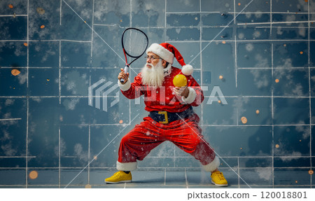 A man dressed as Santa Claus playing tennis with a racket and ball 120018801