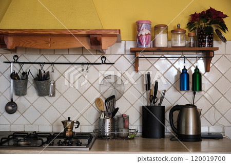 closeup of a kitchen work top full of accessories closeup of a kitchen work top full of accessories 120019700