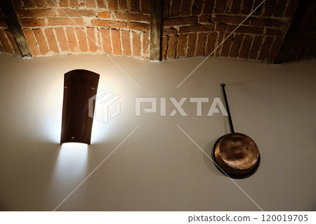 particular of a spotlight and copper pot in a renovated vintage tavern particular of a spotlight and copper pot in a renovated vintage tavern 120019705