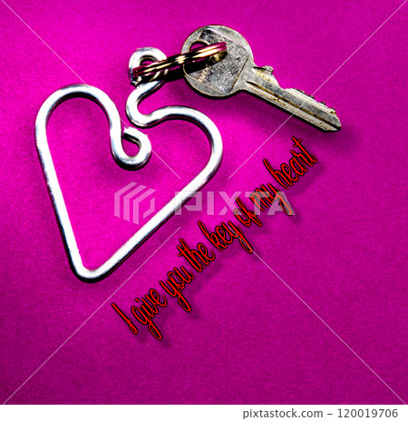 heart-shaped keychain with a key attached on a purple background 120019706
