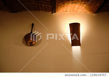 particular of a spotlight and copper pot in a renovated vintage tavern particular of a spotlight and copper pot in a renovated vintage tavern 120019707