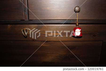 walnut chest of drawers with a santa-shaped bell 120019761
