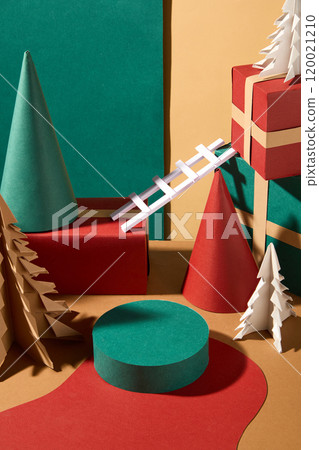 A top view The Christmas image shows an empty green product display stand placed in the middle on red paper, next to paper Christmas trees, cones, and gift boxes in a beige background. A top view The Christmas image shows an empty green product display stand placed in the middle on red paper, next to paper Christmas trees, cones, and gift boxes in a beige background. 120021210