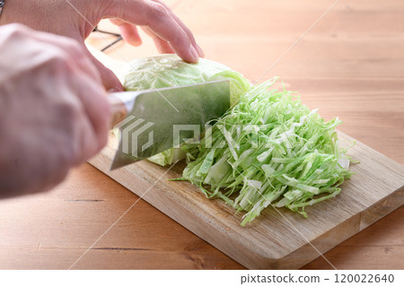 Freshly shredded cabbage (wood grain background) Freshly shredded cabbage (wood grain background) 120022640