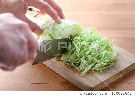 Freshly shredded cabbage (wood grain background) 120022642