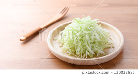 Freshly shredded cabbage (wood grain background) 120022655