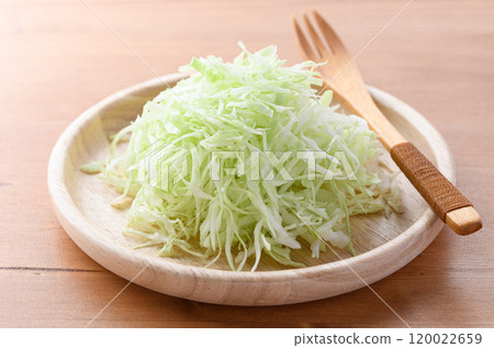 Freshly shredded cabbage (wood grain background) 120022659