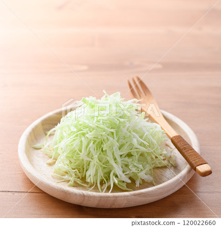 Freshly shredded cabbage (wood grain background) 120022660