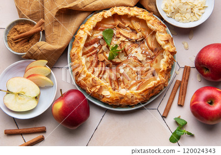 Delicious homemade apple galette with fresh apples, almond slices, and spices Delicious homemade apple galette with fresh apples, almond slices, and spices 120024343
