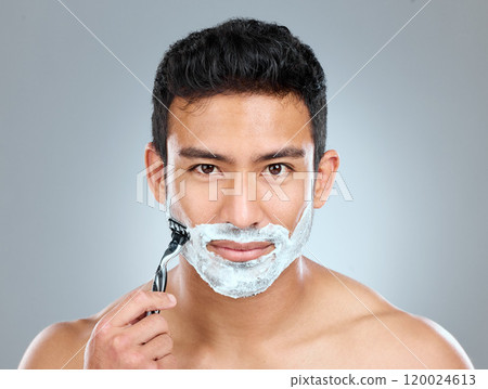 Portrait, shaving and skincare with masculine man in studio on gray background for cosmetic wellness. Beauty. dermatology and razor with face of confident person in bathroom for grooming or hygiene Portrait, shaving and skincare with masculine man in studio on gray background for cosmetic wellness. Beauty. dermatology and razor with face of confident person in bathroom for grooming or hygiene 120024613