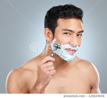 Beauty, portrait and razor with masculine man in studio on gray background for cosmetic wellness. Dermatology, foam or soap for skincare with face of confident person shaving in bathroom for hygiene Beauty, portrait and razor with masculine man in studio on gray background for cosmetic wellness. Dermatology, foam or soap for skincare with face of confident person shaving in bathroom for hygiene 120024648