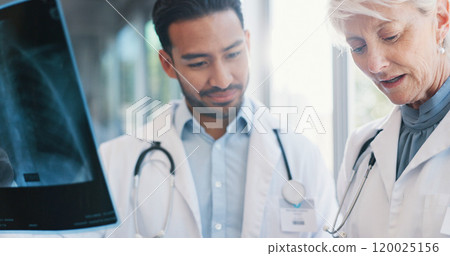 Doctors, x ray and professional analysis in hospital, consultation and teamwork collaboration for patient results. Mature radiologist, film and examine for diagnosis, people and wellness discussion 120025156