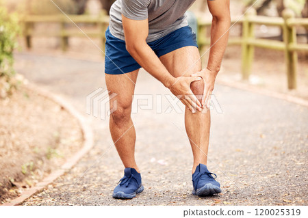 Outdoor, knee pain and hands of person after fitness accident, injury and muscle tension. Nature, road and male runner with fibromyalgia, leg inflammation and massage joint during training session 120025319