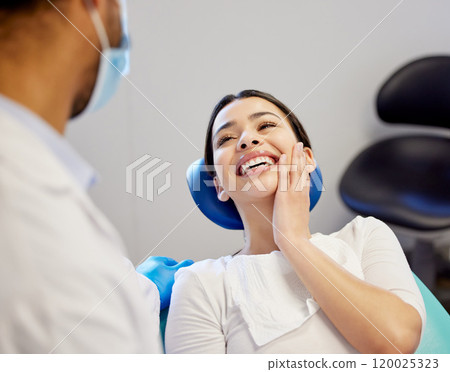 Woman, dentist and happy for dental surgery in clinic with support for teeth removal and treatment with doctor. Female patient, satisfied and smile on consultation for canal procedure and oral care Woman, dentist and happy for dental surgery in clinic with support for teeth removal and treatment with doctor. Female patient, satisfied and smile on consultation for canal procedure and oral care 120025323