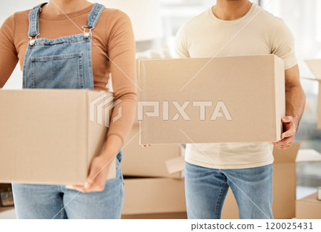 Hands, people and moving with boxes in home, teamwork or packing for real estate. Couple, together and collaboration in property with cardboard container, mortgage loan or investment in house Hands, people and moving with boxes in home, teamwork or packing for real estate. Couple, together and collaboration in property with cardboard container, mortgage loan or investment in house 120025431