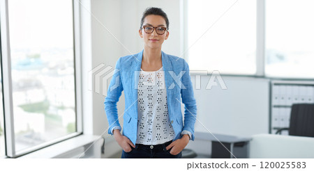 Office, portrait and business woman with confidence for creative agency, professional career and job. Workspace, female graphic designer and ready for startup project, pride and smile for internship 120025583