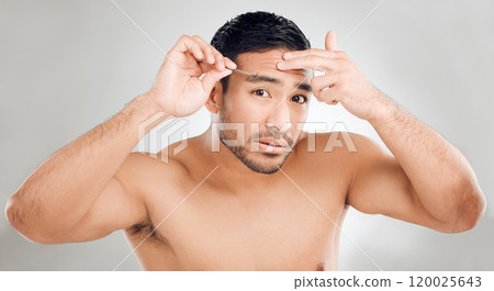 Man, tweezers and eyebrow in studio portrait, grooming and plucking for epilation on white background. Male person, skincare and maintenance for hygiene routine or clean, beauty and facial cosmetics 120025643