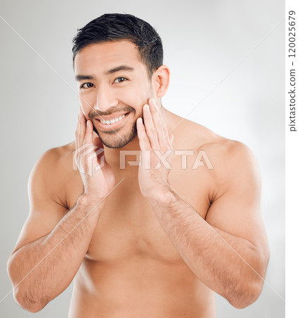 Asian man, hands and portrait of skincare in studio for morning routine, wellness or natural treatment on white background. Grooming, body and model with smile for confidence, facial or satisfaction Asian man, hands and portrait of skincare in studio for morning routine, wellness or natural treatment on white background. Grooming, body and model with smile for confidence, facial or satisfaction 120025679