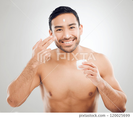 Man, portrait and cream jar in studio for skincare application, moisturizer and white background. Male person, container and lotion pot for beauty or hydrated skin, ointment and sunscreen for facial Man, portrait and cream jar in studio for skincare application, moisturizer and white background. Male person, container and lotion pot for beauty or hydrated skin, ointment and sunscreen for facial 120025699