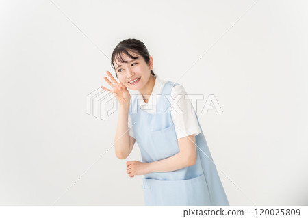 Woman in apron, nursery teacher, caregiver, listening 120025809