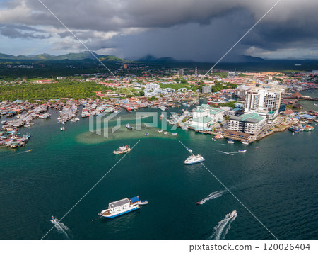 Aerial drone view of commercial pier and fisherman village at Semporna, Malaysia 120026404