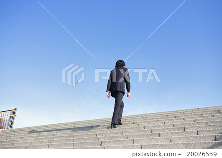 Business image: Back view of a man in a suit Business image: Back view of a man in a suit 120026539