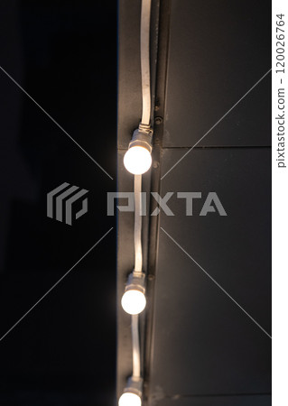 Garland along the building at night. Illumination of buildings Garland along the building at night. Illumination of buildings 120026764