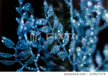 Blue christmas ornament glittering on dark background. New Year 2025 120027378