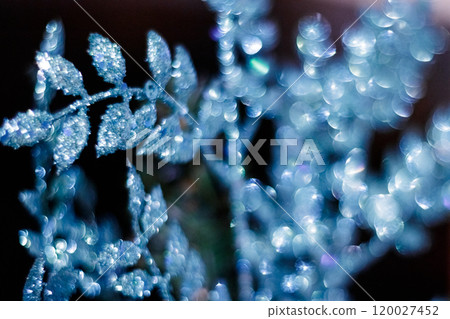 Blue christmas ornament glittering on dark background. New Year 2025 120027452