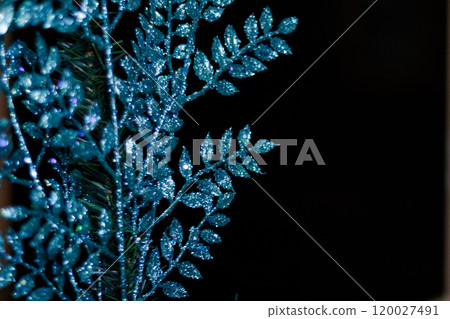 Blue christmas ornament glittering on dark background. New Year 2025 120027491