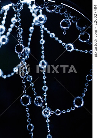 Crystal beads hanging disco garland shining on dark background. Christmas, New Year 2025 120027494
