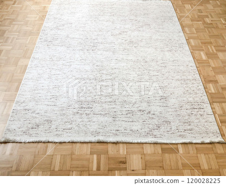 white clean rug or carpet on wooden parquet floor in living room at home white clean rug or carpet on wooden parquet floor in living room at home 120028225