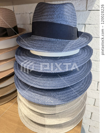 stack of blue straw hats in shop stack of blue straw hats in shop 120028226