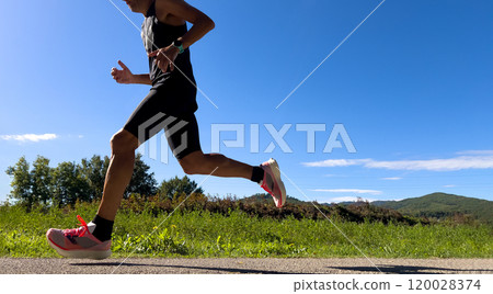 male runner running marathon race near of Borgo San Lorenzo male runner running marathon race near of Borgo San Lorenzo 120028374