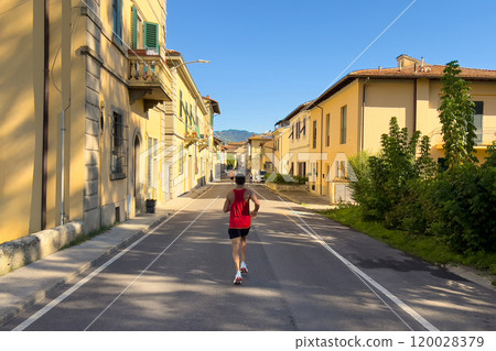 rear view runner running down street of Italian city half marathon race 120028379