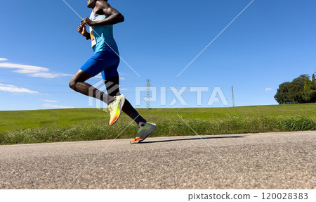 male rwandan runner running marathon in Italy 120028383