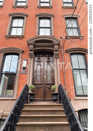 Brownstone entrance, facade of the building, staircase leading to the door, Manhattan, NYC, NY, USA 120029321