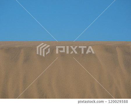 Sand textured pattern with copy space close up in Maspalomas, Gran Canaria. Abstract background wallpaper. Sand waves in a desert dune against the sky Sand textured pattern with copy space close up in Maspalomas, Gran Canaria. Abstract background wallpaper. Sand waves in a desert dune against the sky 120029388