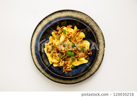 Crispy fries topped with caramelized onions and chanterelle mushrooms, garnished with fresh dill 120030258