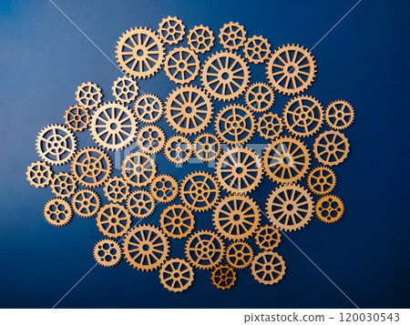 Top view wooden gear on a blue background. Top view wooden gear on a blue background. 120030543