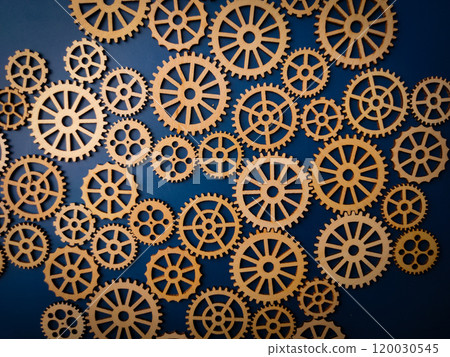 Top view wooden gear on a blue background. Top view wooden gear on a blue background. 120030545
