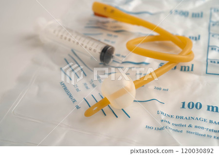 Foley catheter and urine drainage bag collect urine for disability or patient in hospital. Foley catheter and urine drainage bag collect urine for disability or patient in hospital. 120030892